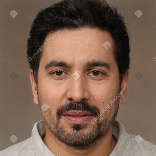 Joyful white adult male with short  black hair and brown eyes