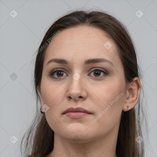 Neutral white young-adult female with long  brown hair and brown eyes