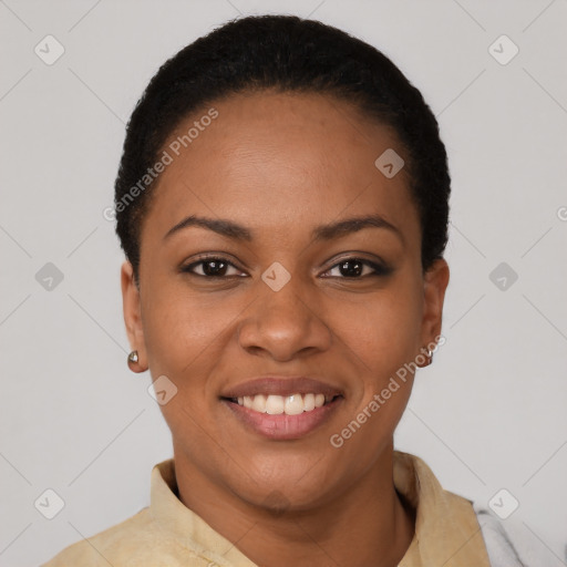 Joyful black young-adult female with short  black hair and brown eyes