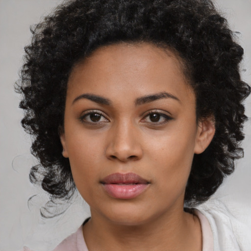Joyful latino young-adult female with medium  black hair and brown eyes