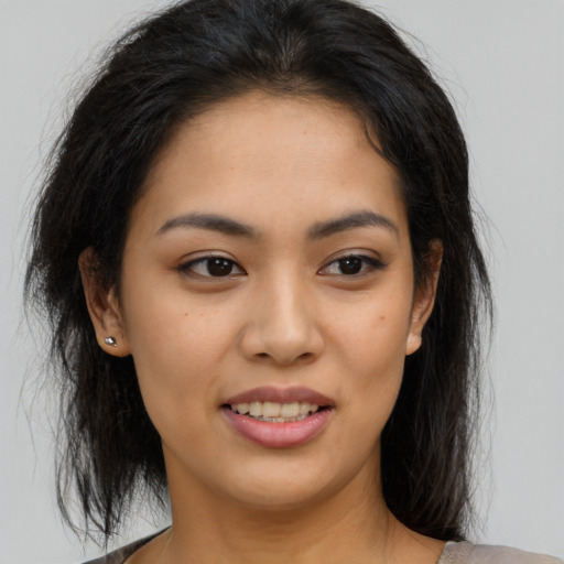 Joyful asian young-adult female with medium  brown hair and brown eyes