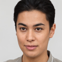 Joyful latino young-adult male with short  brown hair and brown eyes