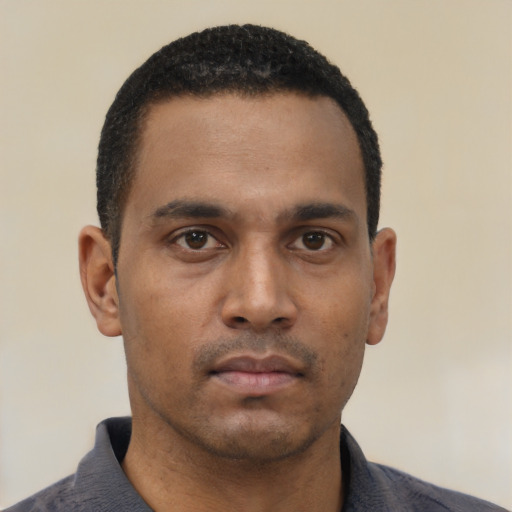 Neutral black young-adult male with short  black hair and brown eyes