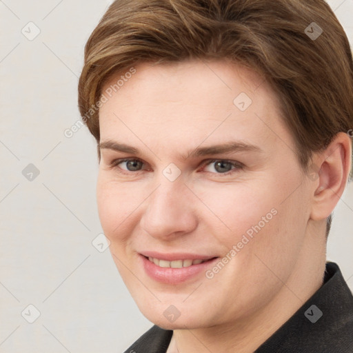 Joyful white young-adult female with short  brown hair and grey eyes