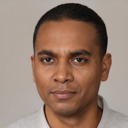 Neutral black young-adult male with short  black hair and brown eyes