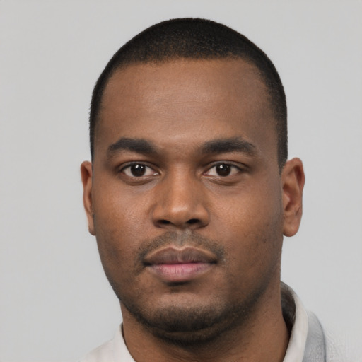 Neutral black young-adult male with short  black hair and brown eyes