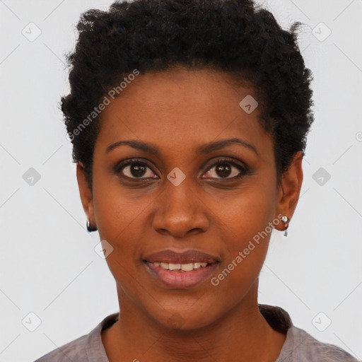 Joyful black young-adult female with short  black hair and brown eyes