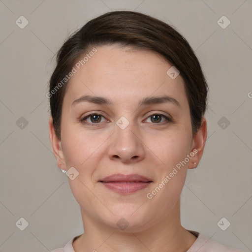 Joyful white young-adult female with short  brown hair and brown eyes