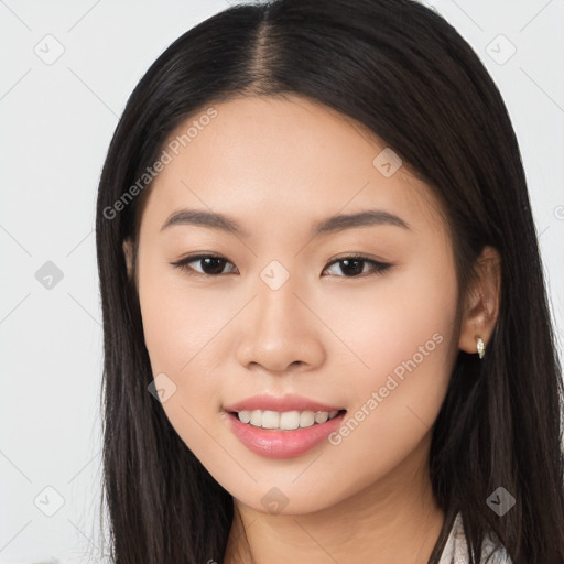 Joyful asian young-adult female with long  brown hair and brown eyes