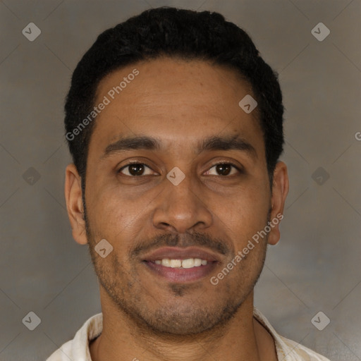 Joyful latino young-adult male with short  black hair and brown eyes