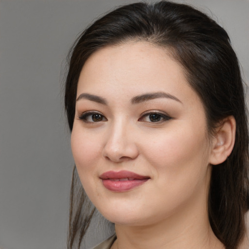 Joyful white young-adult female with medium  brown hair and brown eyes