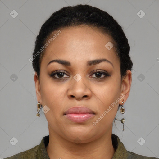 Joyful black young-adult female with short  black hair and brown eyes