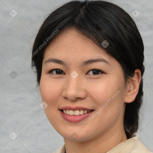 Joyful asian young-adult female with medium  brown hair and brown eyes