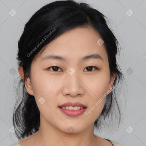 Joyful asian young-adult female with medium  black hair and brown eyes