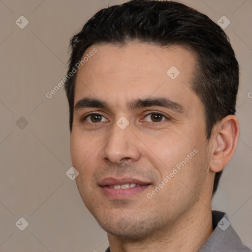 Joyful white young-adult male with short  black hair and brown eyes