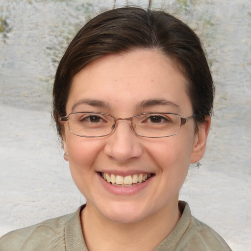 Joyful white adult female with short  brown hair and brown eyes