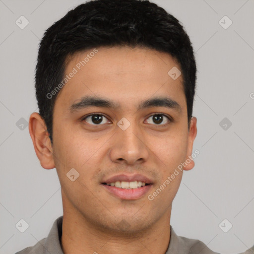 Joyful latino young-adult male with short  brown hair and brown eyes