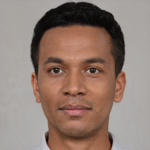 Neutral latino young-adult male with short  black hair and brown eyes