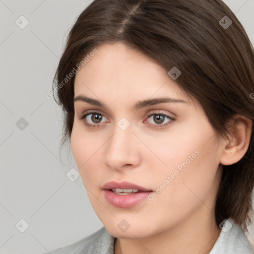 Neutral white young-adult female with medium  brown hair and brown eyes