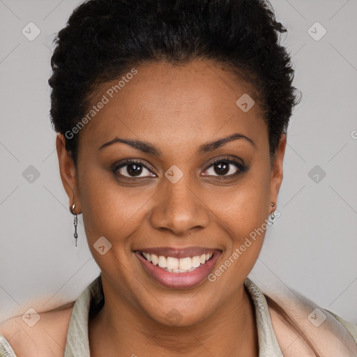 Joyful black young-adult female with short  brown hair and brown eyes