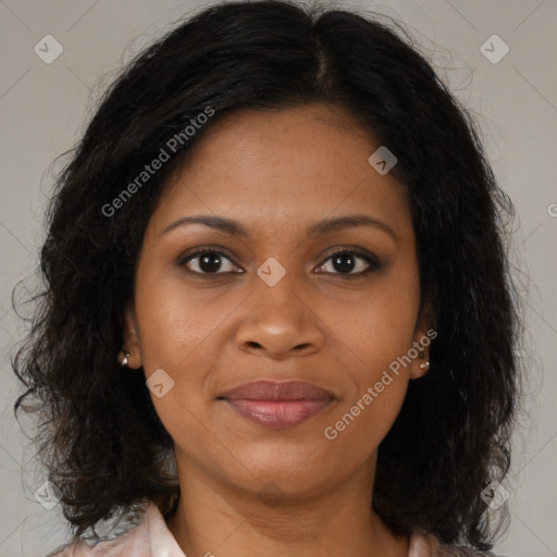 Joyful black adult female with medium  brown hair and brown eyes