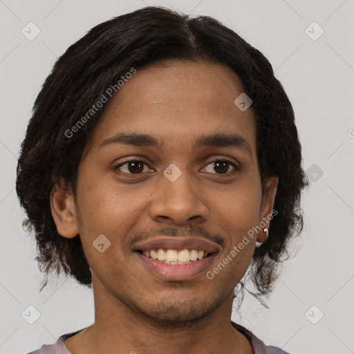 Joyful latino young-adult male with short  brown hair and brown eyes