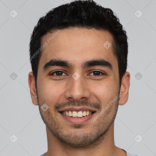 Joyful latino young-adult male with short  black hair and brown eyes