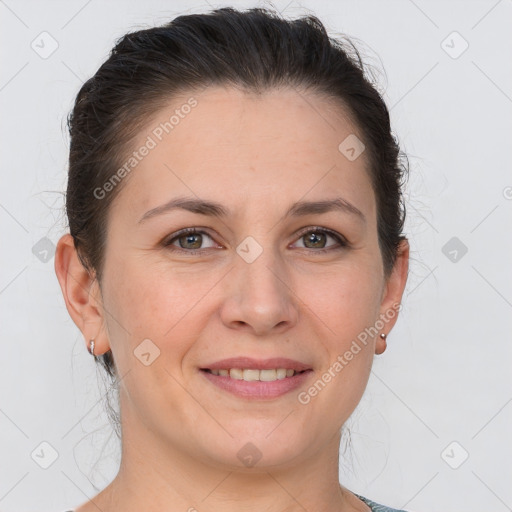 Joyful white adult female with short  brown hair and brown eyes