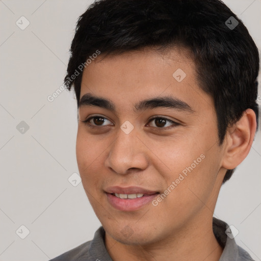 Joyful asian young-adult male with short  black hair and brown eyes