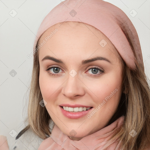 Joyful white young-adult female with long  brown hair and blue eyes