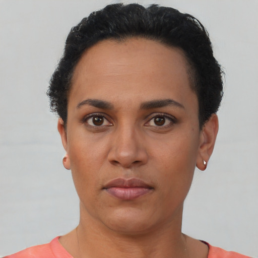 Neutral latino young-adult female with short  black hair and brown eyes