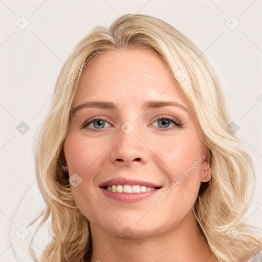 Joyful white young-adult female with long  brown hair and blue eyes