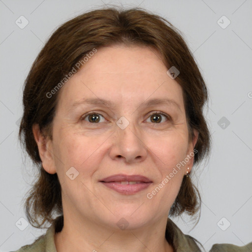 Joyful white adult female with medium  brown hair and grey eyes