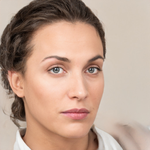 Neutral white young-adult female with short  brown hair and grey eyes