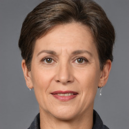 Joyful white adult female with short  brown hair and brown eyes