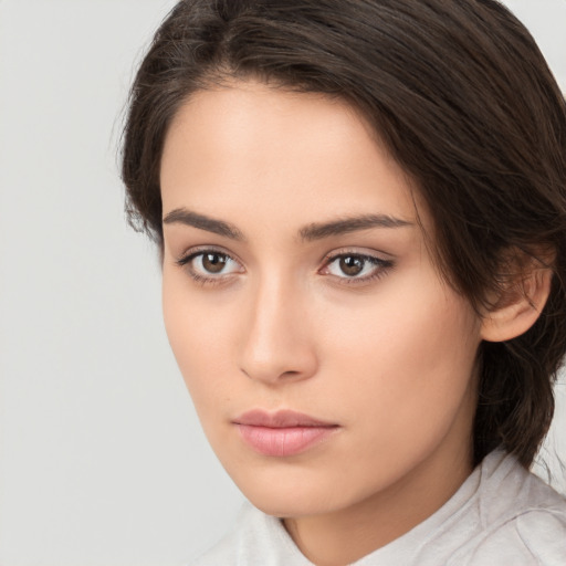 Neutral white young-adult female with medium  brown hair and brown eyes