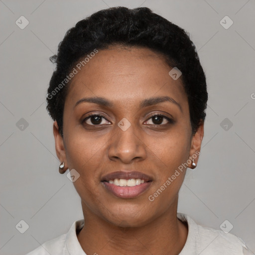 Joyful black young-adult female with short  black hair and brown eyes