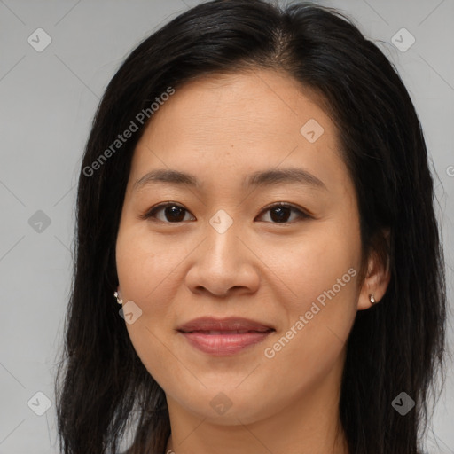 Joyful asian young-adult female with long  brown hair and brown eyes