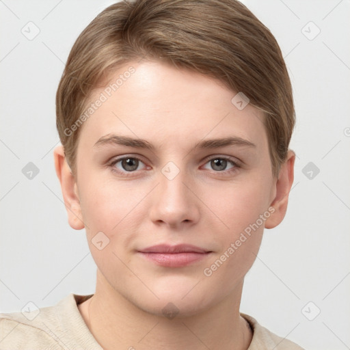 Joyful white young-adult female with short  brown hair and grey eyes