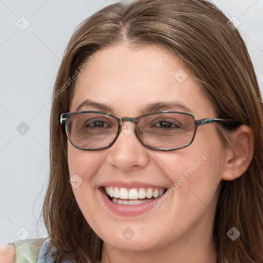 Joyful white young-adult female with long  brown hair and blue eyes