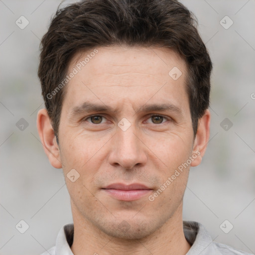 Joyful white adult male with short  brown hair and brown eyes