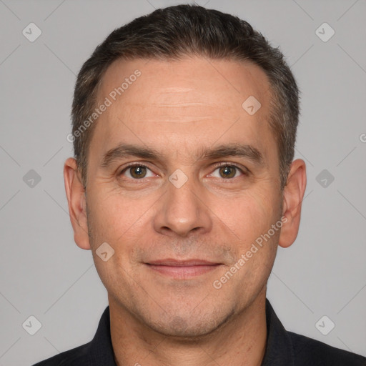 Joyful white adult male with short  brown hair and brown eyes