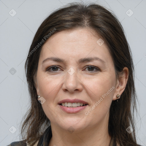 Joyful white adult female with medium  brown hair and grey eyes