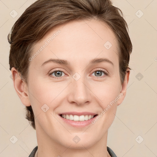 Joyful white young-adult female with short  brown hair and grey eyes