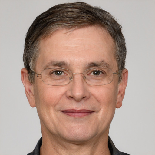 Joyful white middle-aged male with short  brown hair and grey eyes