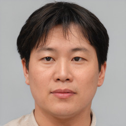 Neutral asian adult male with short  brown hair and brown eyes