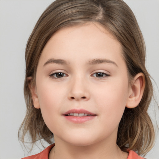 Joyful white child female with medium  brown hair and brown eyes