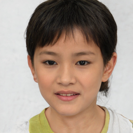 Joyful asian child female with short  brown hair and brown eyes