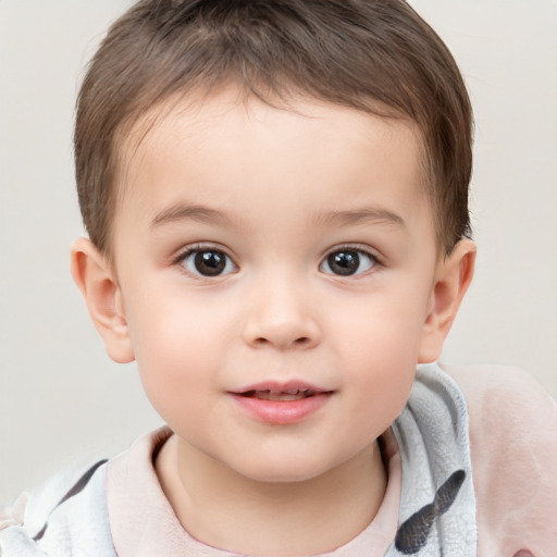 Joyful white child male with short  brown hair and brown eyes