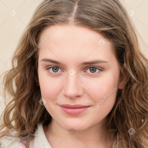 Joyful white young-adult female with long  brown hair and green eyes